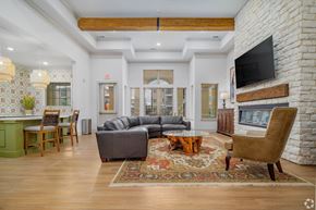 San Antonio apartment for rent - A living room with a grey couch and a wooden coffee table.