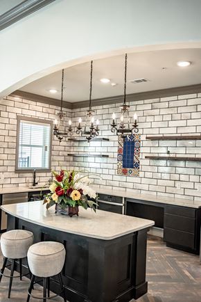 San Antonio apartment for rent - a kitchen with a marble counter top and white brick walls