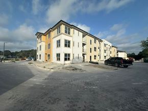 San Antonio apartment for rent - an apartment building with a car parked in a parking lot