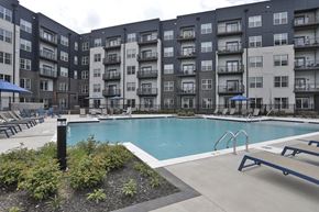 Cincinnati apartment for rent - A large swimming pool surrounded by apartment buildings.