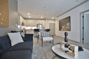 Cincinnati apartment for rent - a living room with a couch and chairs and a kitchen