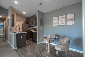 Maineville apartment for rent - A kitchen with a dining table and chairs.