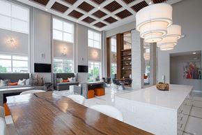 West Chester apartment for rent - A modern kitchen with a wooden table and white chairs.