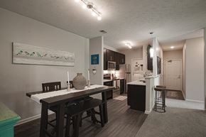 Mason apartment for rent - A kitchen with a dining table and chairs.