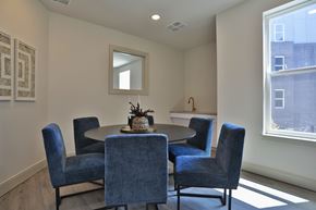 Cincinnati apartment for rent - A dining room with a round table and six chairs.