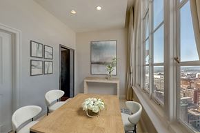 Baltimore apartment for rent - A dining room with a wooden table and chairs.