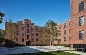 Chicago apartment for rent - a large brick building with trees in front of it