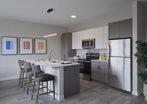Chicago apartment for rent - A modern kitchen with a white island and stainless steel appliances.