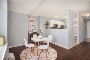 Chicago apartment for rent - A kitchen with a table and chairs in the middle of the room.