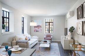 Chicago apartment for rent - a living room with a white couch and a table