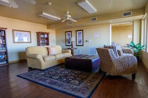 Las Vegas apartment for rent - A living room with a couch, chair, and rug.