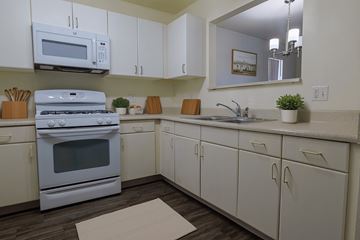 Las Vegas apartment for rent - A white kitchen with a microwave above the stove.