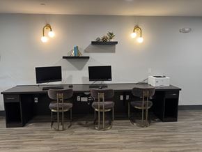 North Las Vegas apartment for rent - A modern office with a black desk and two chairs.