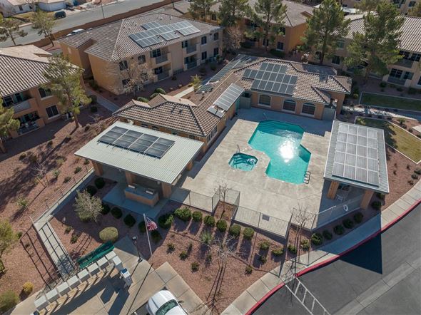 Henderson apartment for rent - A large house with a pool and solar panels on the roof.