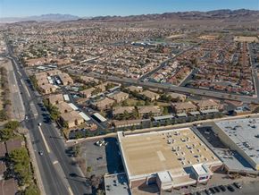 Henderson apartment for rent - A large open parking lot is surrounded by apartment buildings.