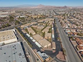 Henderson apartment for rent - A cityscape with a mountain in the background.