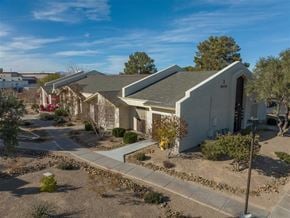 Henderson apartment for rent - A sunny day at a residential area with houses and trees.