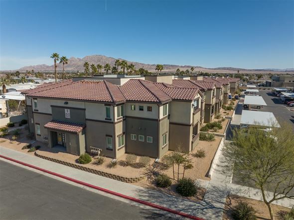 Las Vegas apartment for rent - A row of houses with a mountain in the background.