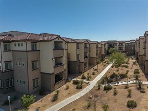 Las Vegas apartment for rent - Apartment complex with brown roofs and beige walls.