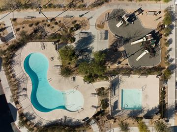 Las Vegas apartment for rent - An aerial view of a park with a large blue pool and a smaller pool.