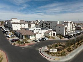 Las Vegas apartment for rent - A view of a housing complex with a sign that says Flamingo Fires.