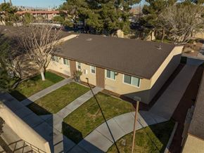Las Vegas apartment for rent - A house with a brown roof and a green lawn.