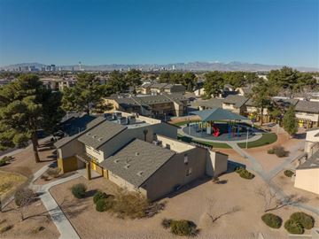 Las Vegas apartment for rent - A school building with a playground in the foreground and mountains in the background.