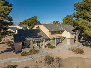 Las Vegas apartment for rent - A house with a grey roof and a brown garage door.