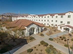 Las Vegas apartment for rent - A white building with a red roof and the number 2602 on it.