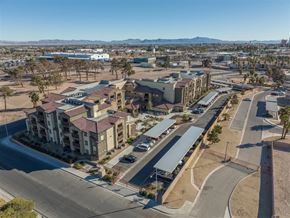 North Las Vegas apartment for rent - A large apartment complex with a parking lot in front.