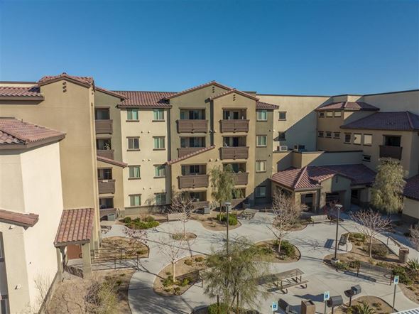 North Las Vegas apartment for rent - A sunny day at a courtyard surrounded by apartment buildings.