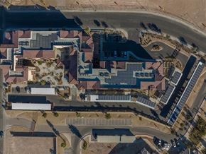 North Las Vegas apartment for rent - A large building complex with a parking lot in front.