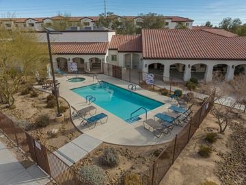Las Vegas apartment for rent - an aerial view of a swimming pool in front of a house
