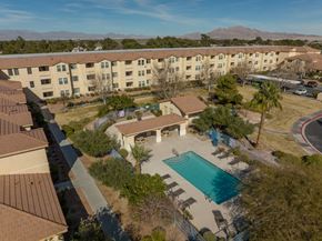 Las Vegas apartment for rent - A pool in a courtyard surrounded by buildings.