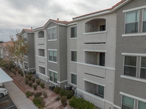 Las Vegas apartment for rent - a row of apartment buildings with a street in front of them