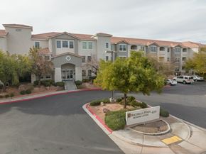 Las Vegas apartment for rent - an empty parking lot in front of an apartment building