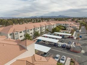 Las Vegas apartment for rent - an aerial view of a parking lot with several apartment buildings and cars