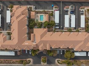 Las Vegas apartment for rent - an aerial view of a neighborhood with houses and rooftops and cars
