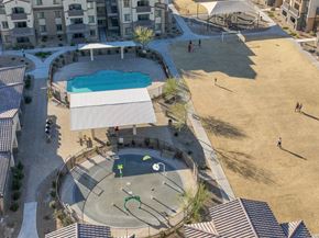 Las Vegas apartment for rent - an aerial view of a playground and a pool in an apartment complex