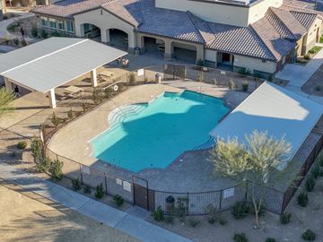 Las Vegas apartment for rent - an aerial view of a swimming pool in front of a building