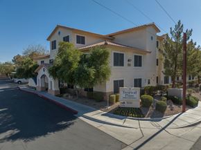 Las Vegas apartment for rent - a large building with a sign in front of it