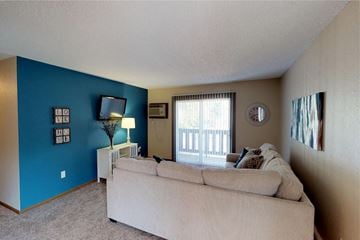 Grand Forks apartment for rent - A living room with a couch and a lamp.