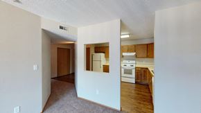 Sioux Falls apartment for rent - A kitchen with white appliances and wooden cabinets.