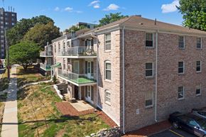 Des Moines apartment for rent - an aerial view of a brick apartment building with balconies