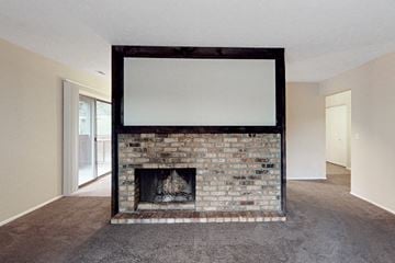 Bellevue apartment for rent - a living room with a fireplace and a tv on top of it