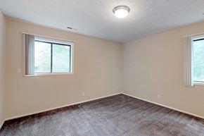 Bellevue apartment for rent - an empty bedroom with carpet and a window