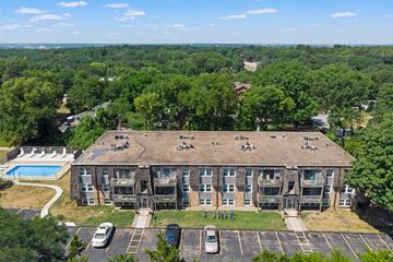 Des Moines apartment for rent - an aerial view of an apartment building with a pool and trees