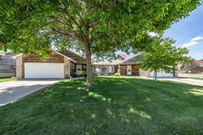 Sioux Falls townhouse for rent - A house with a tree in front of it.