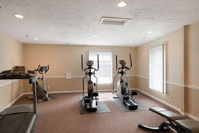 Bellevue apartment for rent - a gym with exercise equipment in the corner of a room