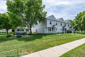 Sioux Falls townhouse for rent - A white house with a tree in front of it.